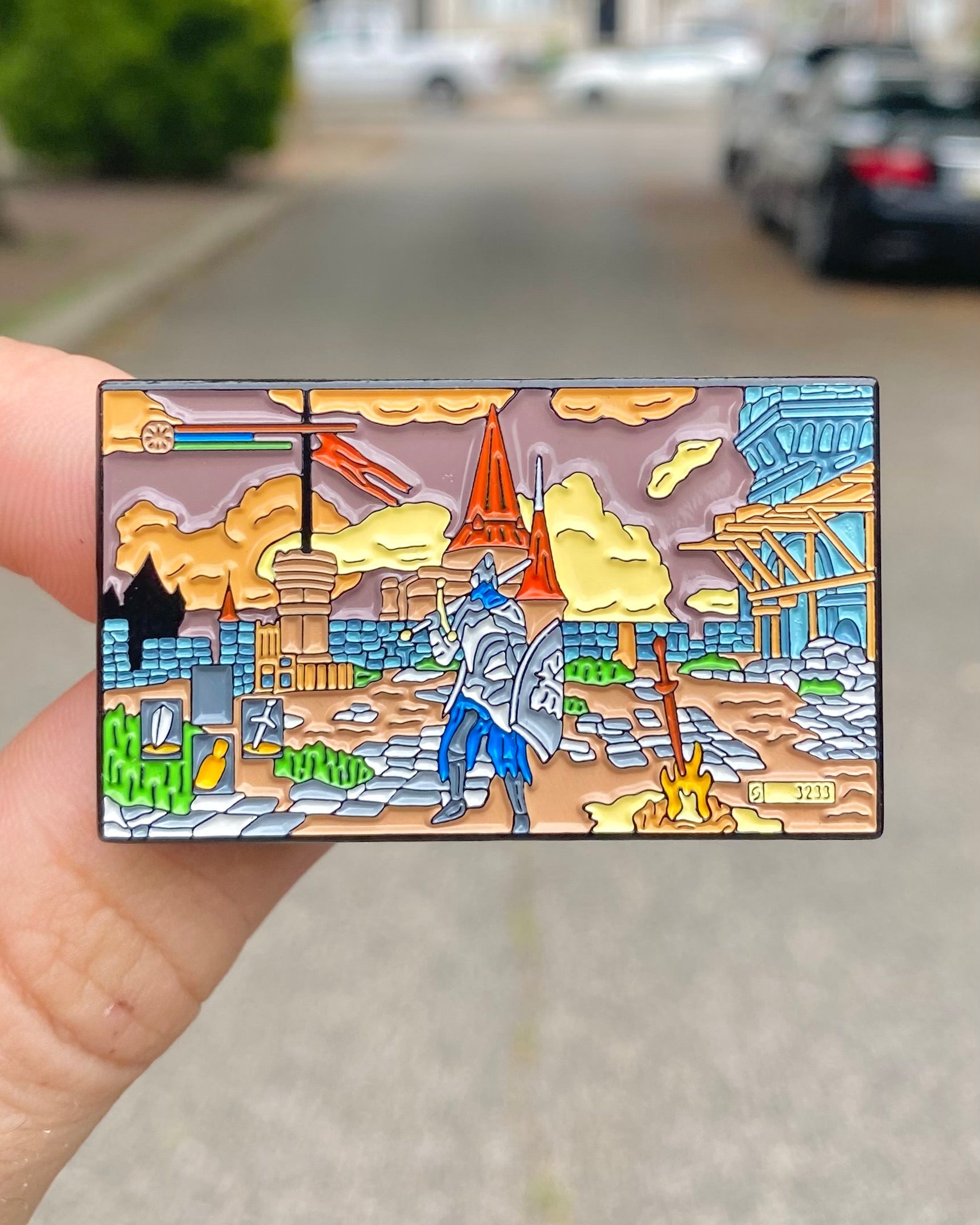 Dark Souls Praise the Sun Solaire enamel pin held in hand