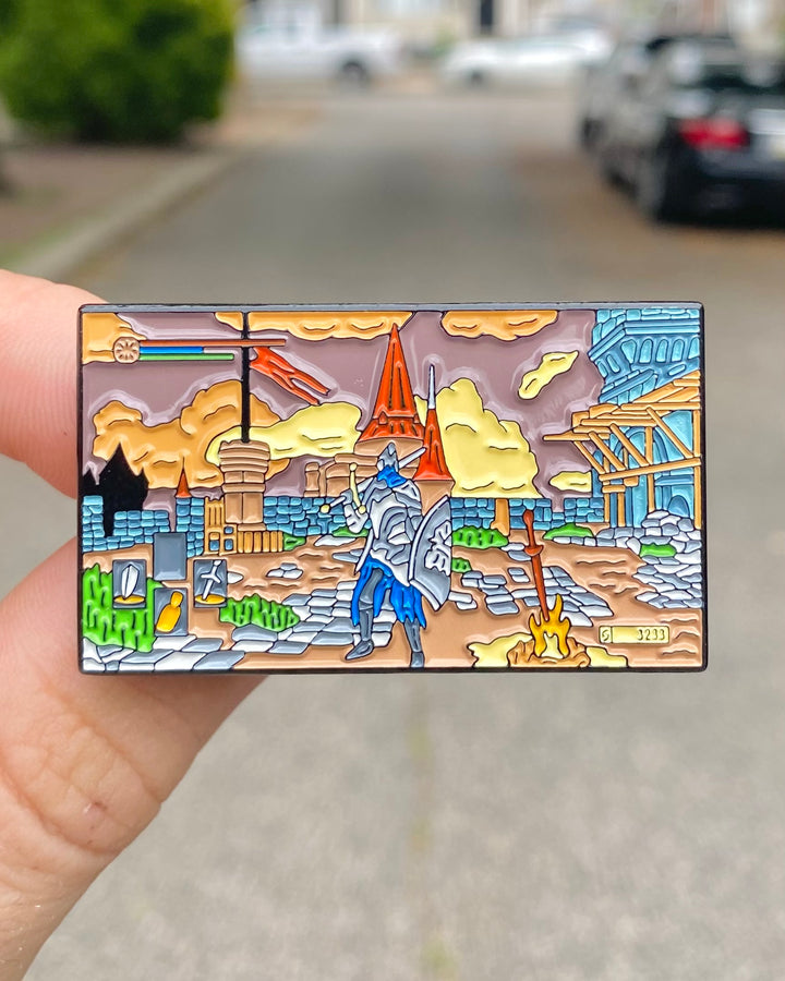 Dark Souls Praise the Sun Solaire enamel pin held in hand