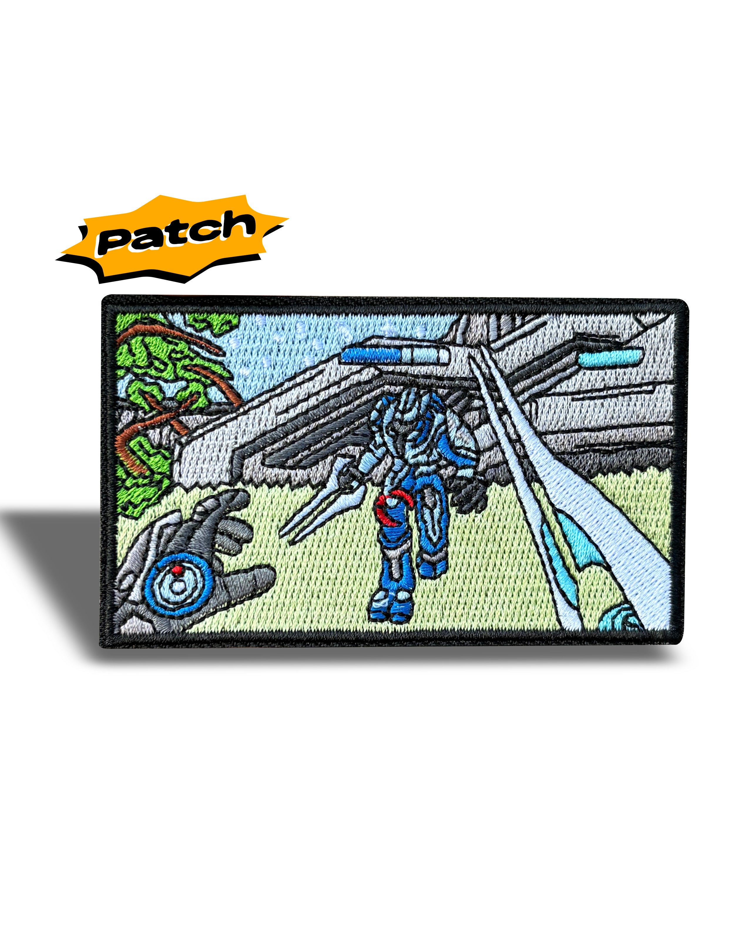 An embroidered rectangular patch featuring a sci-fi mecha robot in blue and red armor walking in front of a futuristic gray structure, with a yellow 'Patch' logo graphic above it on a white background.