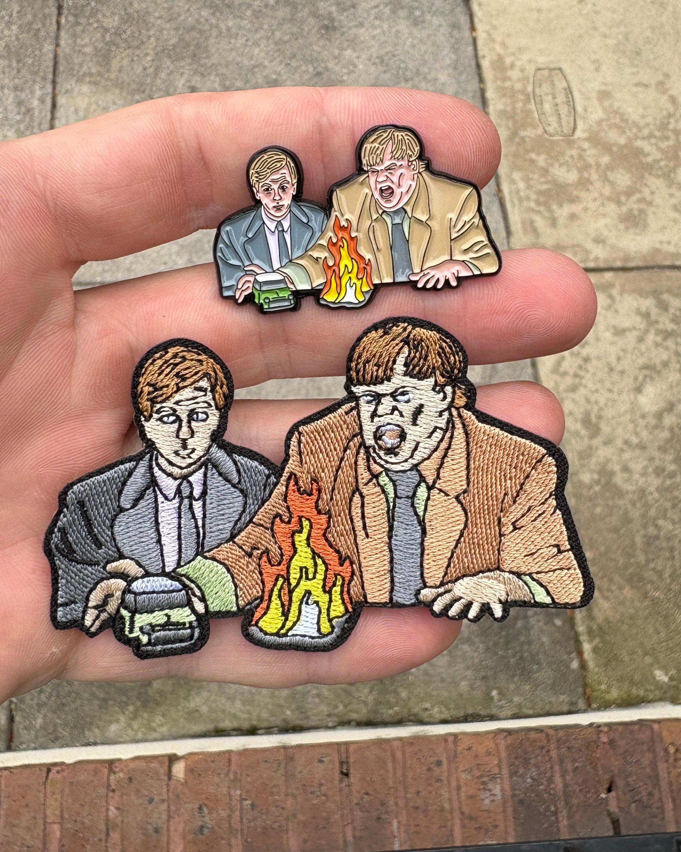 Tommy Boy Movie embroidered patches in two sizes held in hand